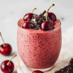 Glass_of_our_chocolate_cherry_protein_shake_topped_with_cherries_and_shaved_dark_chocolate