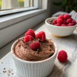 Featured image of chocolate protein mousse raspberry cups in a white bowl