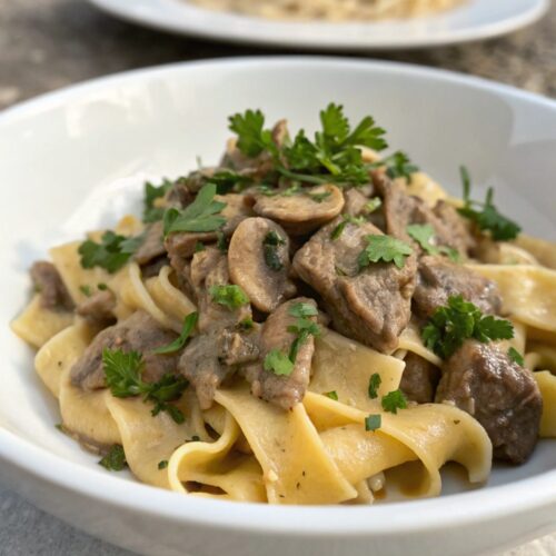 A delicious plate of classic beef stroganoff with creamy sauce