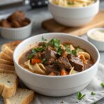 Classic Beef Stroganoff Recipe served with garnished in a white ceramic bowl