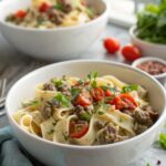 A visually delicious serving of creamy ground beef pasta in a bowl