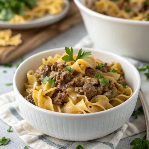 Hero shot of the ground beef stroganoff recipe served in a bowl with garnish.