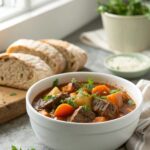 A steaming bowl of old-fashioned beef stew, rich in flavor and hearty goodness.