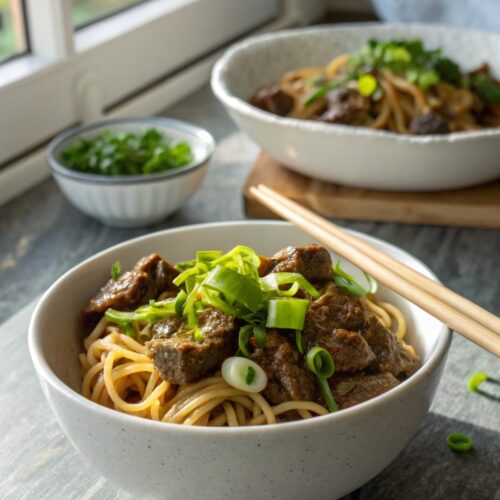 Close-up of delicious slow cooker Korean beef noodles served in a bowl.