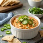 Close-up image of a creamy, cheesy Buffalo Chicken Dip.