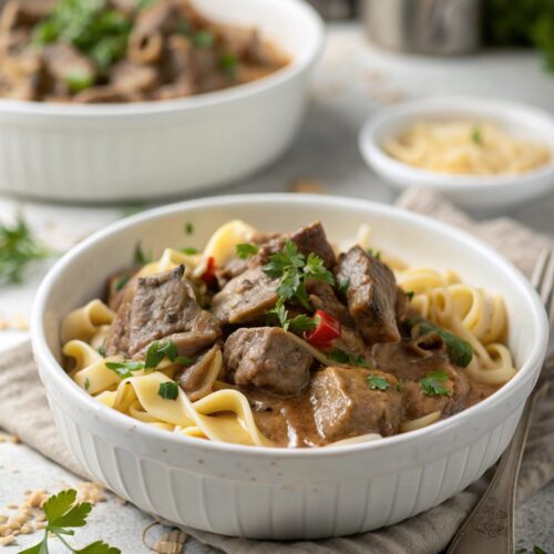 Plated and garnished stovetop beef stroganoff served warm.