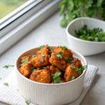 Juicy Cowboy Butter Chicken Bites served in a white ceramic bowl