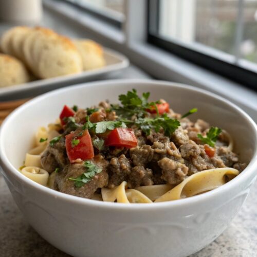 Savory Ground Beef Stroganoff served in a bowl with garnish