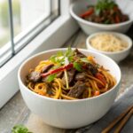 Rich and savory beef lo mein, served hot from the skillet