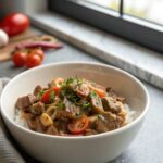 Beef Stroganoff Recipe from Scratch served in a white bowl garnished with parsley