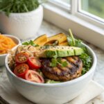 A close-up view of vibrant high protein cheeseburger bowls featuring beef, avocado, and cheese.