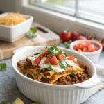 Featured image of a delicious and cheesy beef enchilada casserole