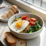 A rich, inviting bowl of high protein breakfast with vibrant colors, including smoked salmon and greens