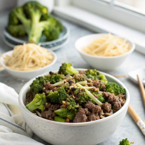 Low-carb ground beef broccoli recipe in a white dish, garnished and ready to serve.