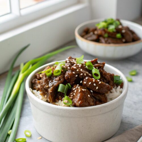Featured image showcasing slow cooker Korean beef with garnish.