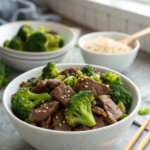 A delicious tender beef broccoli dish served in a modern bowl, showcasing vibrant colors.