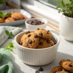 Close-up of vegan chocolate chip cookies served on a white ceramic plate