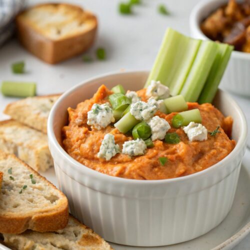 A close-up view of Buffalo Chicken Dip in a serving dish.