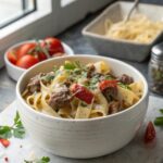 SEO-friendly alt text describing the featured image, showing a serving of creamy beef pasta