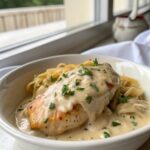 Featured image of creamy smothered chicken breast, showcasing its rich, creamy sauce and tender chicken.