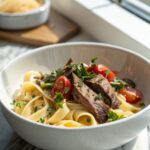 Delicious creamy strip steak pasta served in a bowl