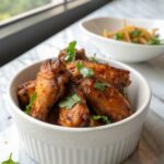 Final display of Honey Garlic Chicken Wings with fresh garnishes