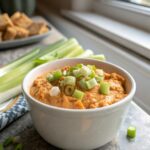 A close-up featured image of buffalo chicken dip recipe, served hot and creamy.