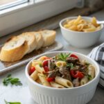 Delicious Philly Cheesesteak Pasta served in a bowl, ready to enjoy.