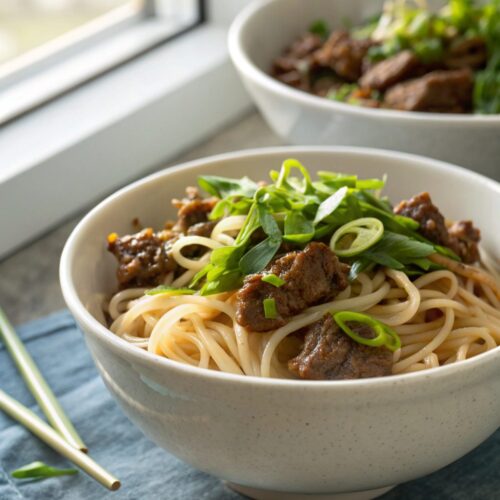 Featured image of irresistible sticky beef noodles dish served elegantly