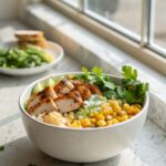Street Corn Chicken Bowl perfectly plated with fresh garnishes.